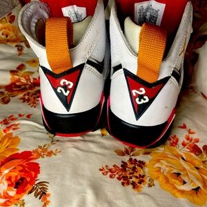 Jordan 7 white, cardinal red, and yellow. Size 3.5 youth.